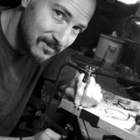 Chris Lann at work in his jewelry studio